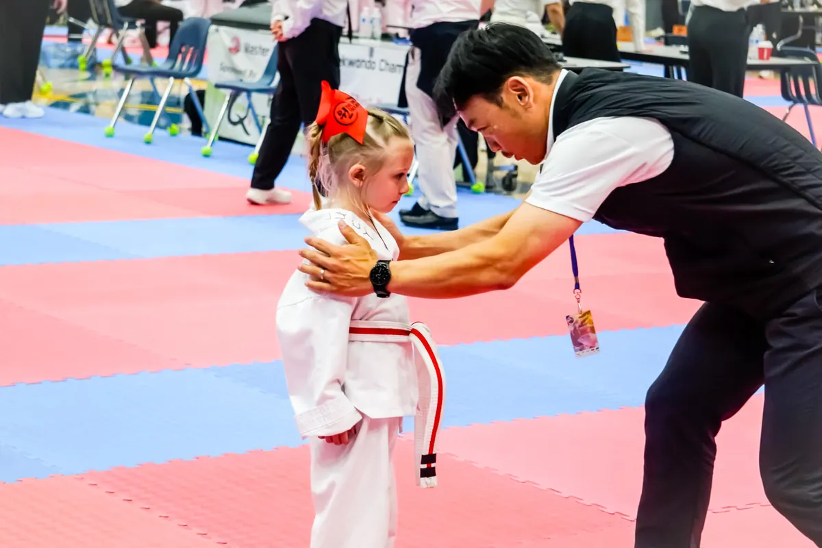 Coach encouraging a young competitor after her event