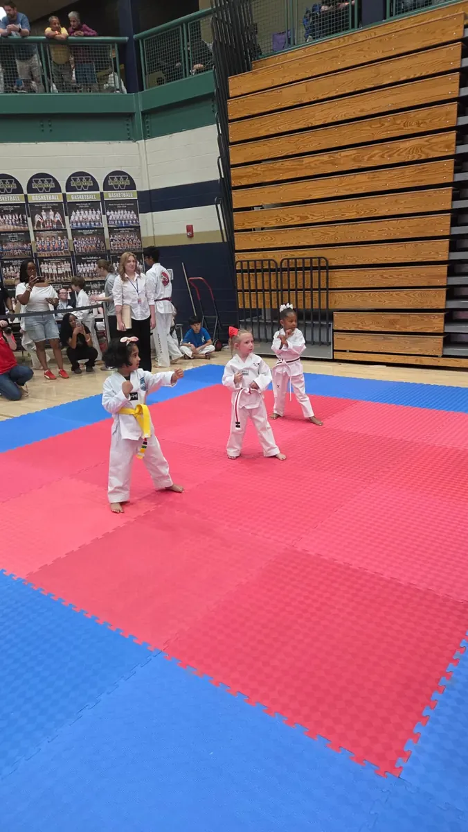 Young students performing together in the championship ring