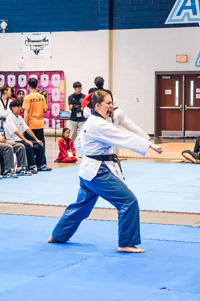 Black belt competitor performing poomsae at the championship